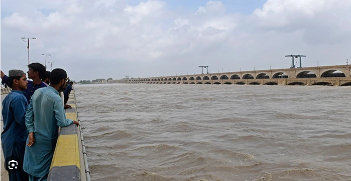 People move to safe places after River Indus bursts its banks in Layyah