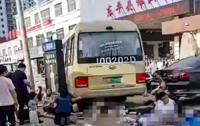 Students among 11 die as China school bus crashes into crowd