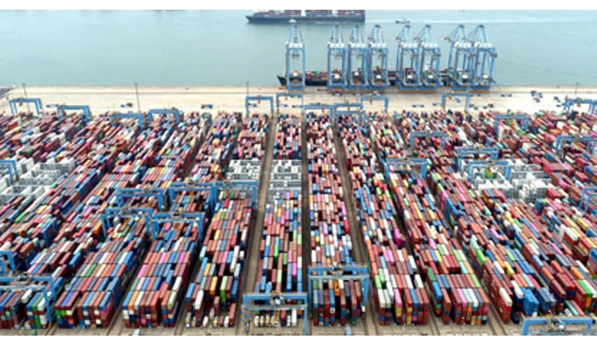 Chinese exports top forecasts but imports slow sharply