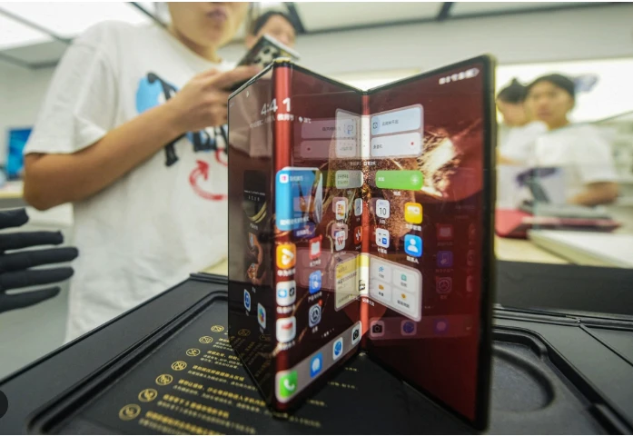 Huawei unveils triple-folding phone with hefty price tag