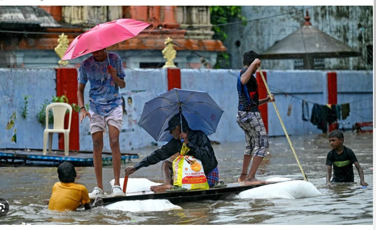 India issues flood warnings as rain pounds south