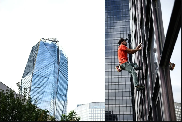 Young climber conquers French skyscrapers in thrilling ascent