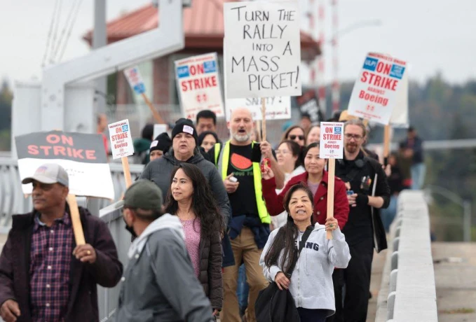 Boeing again raises offer to end strike, union to vote Monday