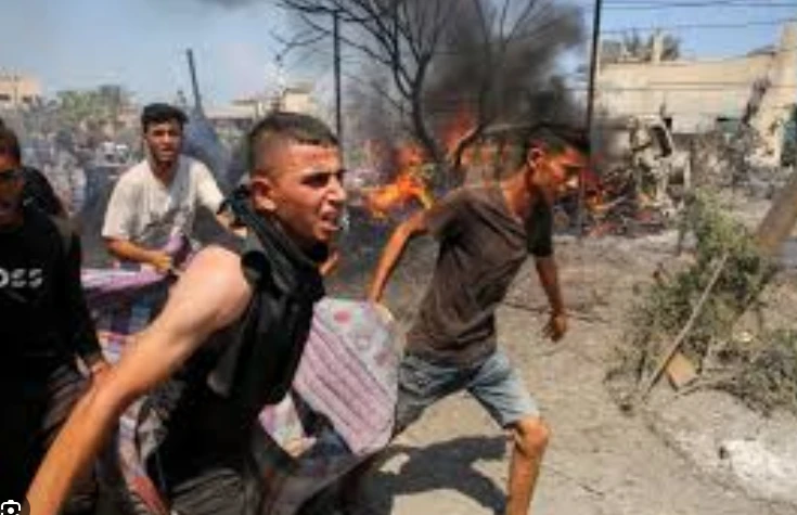 Displaced Palestinians among 13 dead in Israel strikes