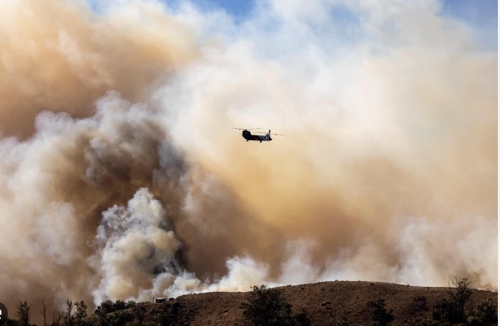 Over 130 homes lost in California wildfire as winds drop