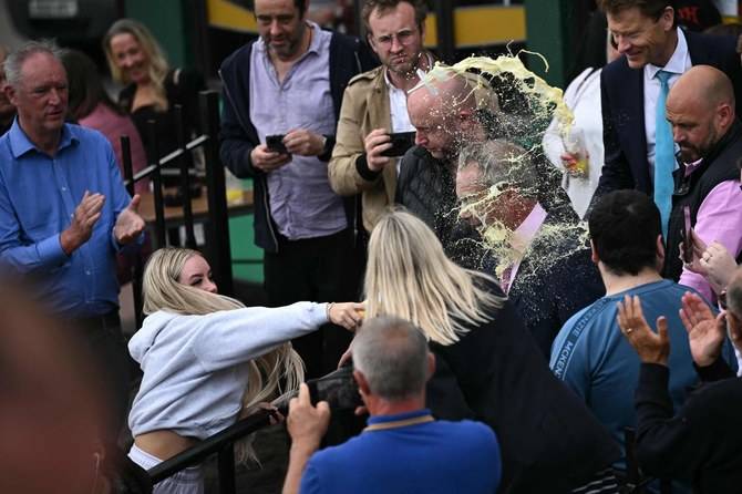 Woman who threw milkshake at Farage avoids jail sentence