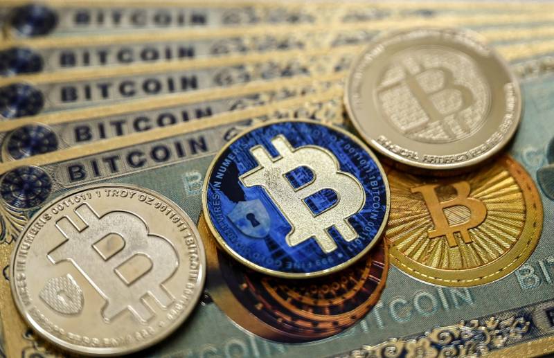 Global stocks mostly fall, bitcoin soars to new peak