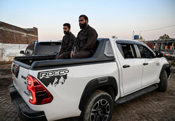 Imposing pickup trucks symbolise Pakistan's power gulf