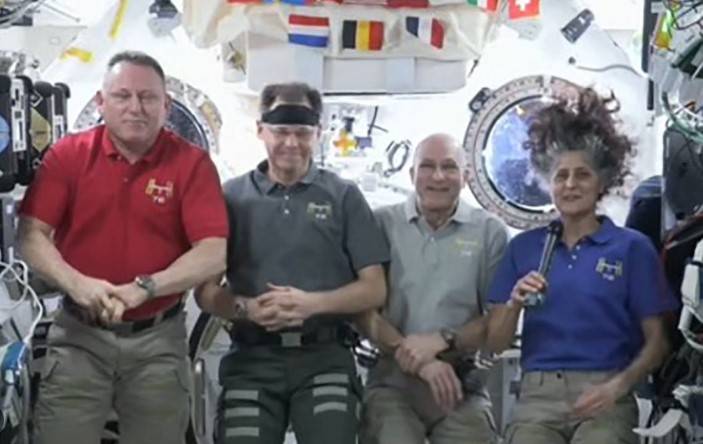 US astronauts upbeat seven months into eight-day mission