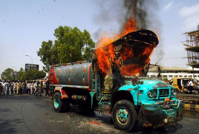 Oil tanker torched after two bikers crushed to death in Karachi