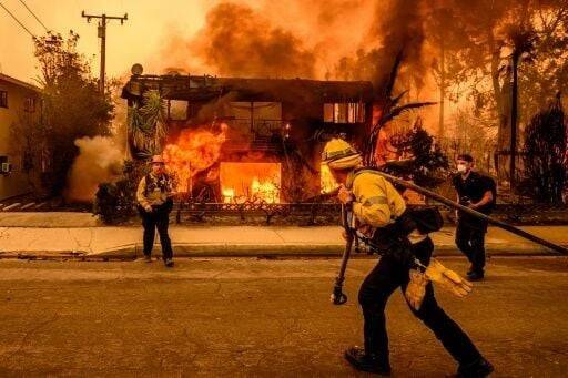 Firefighters race to beat LA blazes as winds grow and death toll hits 16