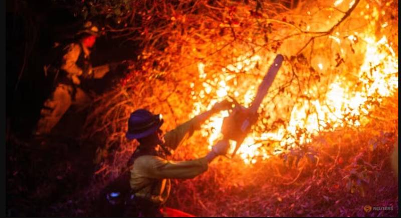 Death toll from Los Angeles fires rises, with dangerous winds incoming